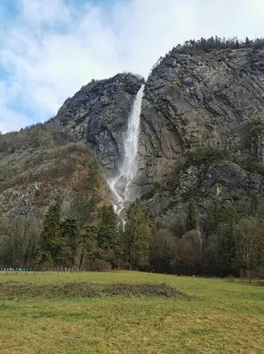 a waterfall on the side of a mountain at Super appartement Cocooning vu Mont Blanc in Sallanches