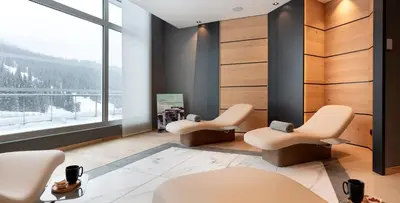 a waiting room with two chairs and a window at MGM Hôtels & Résidences - Hôtel Alhéna in Flaine