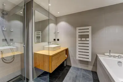 a bathroom with a sink and a shower at Chalet Trois Soeurs in Chamonix-Mont-Blanc