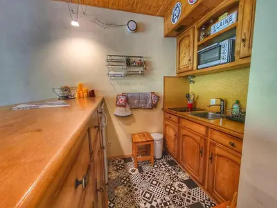 a kitchen with a sink and a counter top at Appart. 38m² pour 6 pers, balcon sud, pied des pistes - FR-1-687-115 in Arâches-la-Frasse