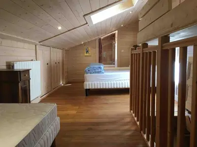 a bedroom with a bed in a wooden room at Le Vallorcin, chalet le Sizeray vallée de Chamonix & Mont Blanc - by ImmoConciergerie in Vallorcine