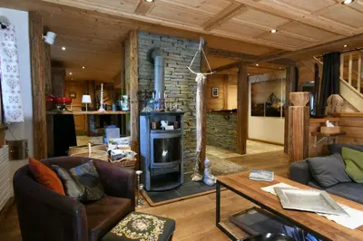 a living room with a wood stove in a room at Le Vallorcin, chalet le Sizeray vallée de Chamonix & Mont Blanc - by ImmoConciergerie in Vallorcine