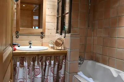 a bathroom with a sink and a bath tub at Le Vallorcin, chalet le Sizeray vallée de Chamonix & Mont Blanc - by ImmoConciergerie in Vallorcine