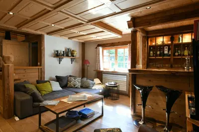 a living room with a couch and a table at Le Vallorcin, chalet le Sizeray vallée de Chamonix & Mont Blanc - by ImmoConciergerie in Vallorcine