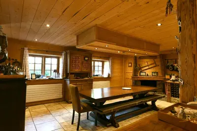 a dining room with a wooden table in a kitchen at Le Vallorcin, chalet le Sizeray vallée de Chamonix & Mont Blanc - by ImmoConciergerie in Vallorcine