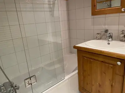 a bathroom with a shower and a sink and a tub at Apartment Ginabelle 1-2 by Interhome in Chamonix-Mont-Blanc