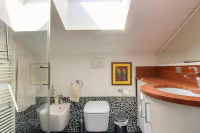 a bathroom with a sink and a toilet and a sink at Appartement Yoga - Vues Chaîne du Mont-Blanc - Calme - Espace Yoga Spacieux in Les Houches
