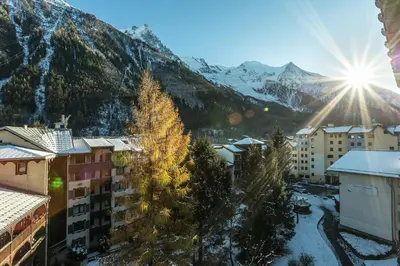a view of a city with snow covered mountains at Apartment Grepon 6 Incredible Mont Blanc View Chamonix in Chamonix-Mont-Blanc