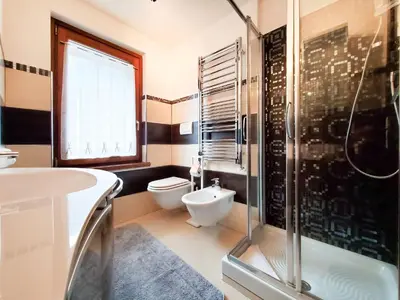a bathroom with a shower and a toilet and a sink at Les Alpes 3 - Central - Rénové - Vue sur la chaîne du Mont-Blanc in Chamonix-Mont-Blanc