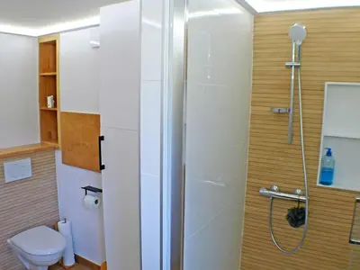 a bathroom with a shower and a toilet at Appartement rénové avec terrasse et parking, fibre incluse - FR-1-629-127 in Samoëns