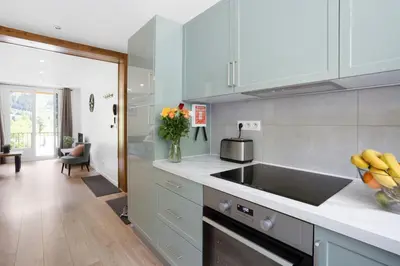 a kitchen with a sink and a vase of flowers at Apartment Le Panoramic in Chamonix-Mont-Blanc