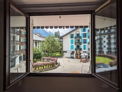 a window with a view of a city street at Central spacious flat with private parking in Chamonix-Mont-Blanc