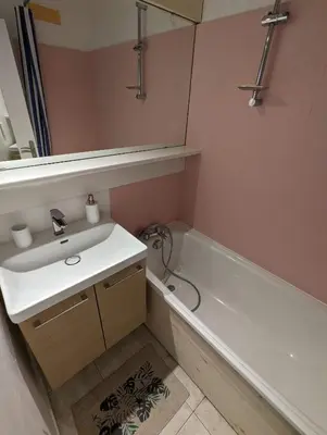 a bathroom with a sink and a bath tub at Central spacious flat with private parking in Chamonix-Mont-Blanc