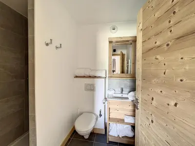a bathroom with a toilet and a sink at Chalet de Luxe 6 Chambres avec Piscine et Bien-Être à Combloux - FR-1-560-107 in Combloux