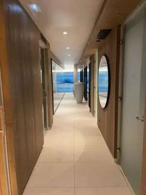 a hallway with a mirror and a tile floor at Appartement standing face mont blanc piscine in Megève