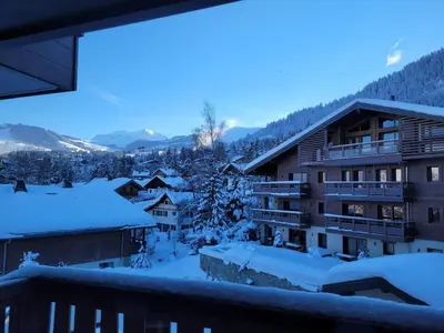 a view from the balcony of a hotel in the snow at Appartement standing face mont blanc piscine in Megève