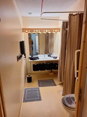 a bathroom with a tub and a sink and a toilet at Très bel Appartement Lumineux à Samoëns in Samoëns