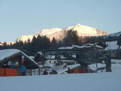 a ski resort with snow covered mountains in the background at Chalet Monte-Pente in Megève