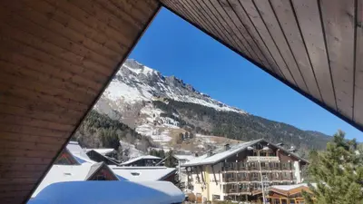 a view of a mountain from a balcony of a hotel at Appartement O'Contamines in Les Contamines-Montjoie