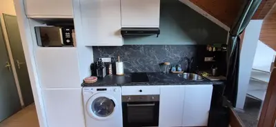 a small kitchen with a washing machine and a washer at Appartement O'Contamines in Les Contamines-Montjoie