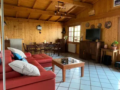 a living room with a red couch and a table at Chalet Mollaz - Mollaz 2 MAE-8074 in Saint-Gervais-les-Bains
