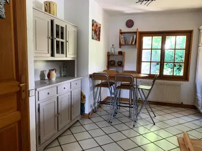 a kitchen with a table and chairs in it at Chalet Mollaz - Mollaz 2 MAE-8074 in Saint-Gervais-les-Bains