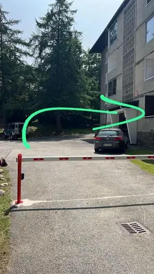a green hoop on a barrier in a parking lot at Masai Megeve in Megève