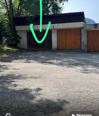a green peace sign in front of a garage at Masai Megeve in Megève