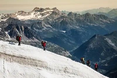 a group of people on top of a snow covered mountain at Apartment Bonatti 201 in Chamonix-Mont-Blanc
