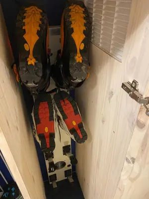 a pair of roller skates hanging on a door at Le Petit Cham in Chamonix-Mont-Blanc