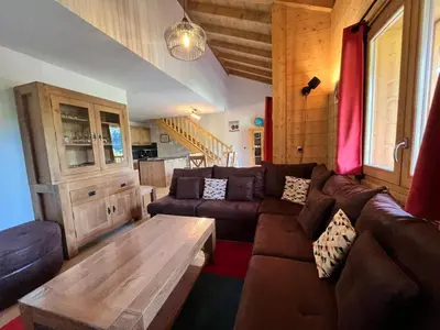 a living room with a couch and a coffee table at Magnifique duplex 3 chambres près du Grand Massif, wifi et garage - FR-1-624-136 in Samoëns
