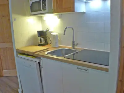 a kitchen with a sink and a mixer on a counter at Appartement T4 pour 8 pers, animaux admis, parking - FR-1-629-131 in Samoëns