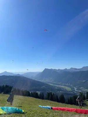 a person riding a bike on a hill with tents at Samoëns 1600 studio au pied des pistes in Samoëns