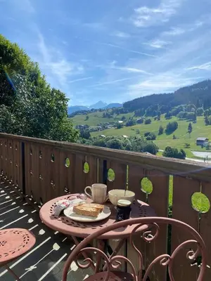 a balcony with a view of the mountains at Chalet Canopée in Demi-Quartier