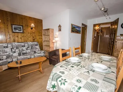 a living room with a table and a dining room at Appartement avec balcon, parking et animaux acceptés à Chamonix - FR-1-343-245 in Chamonix-Mont-Blanc