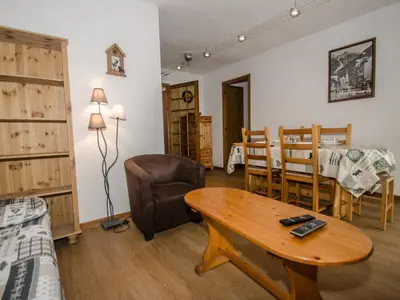 a living room with a table and a dining room at Appartement avec balcon, parking et animaux acceptés à Chamonix - FR-1-343-245 in Chamonix-Mont-Blanc