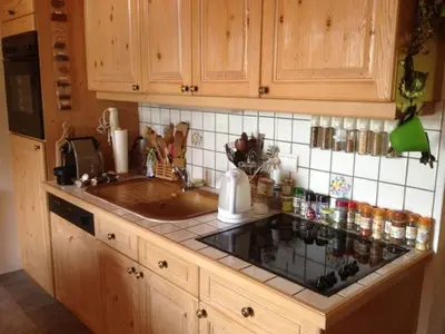 a kitchen with a sink and a counter top at Apartment Village des Oursons Chalet A4 by Interhome in Chamonix-Mont-Blanc