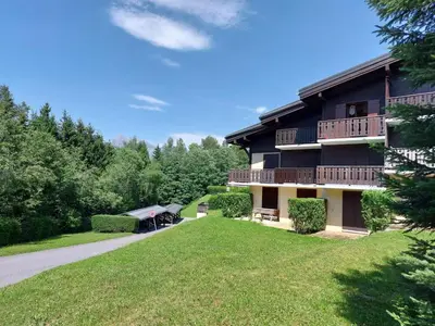 a wooden bridge with trees in the background at Studio La Jacquerie by Interhome in Demi-Quartier