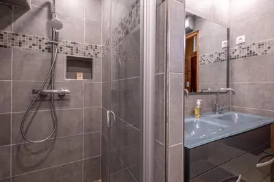 a bathroom with a shower and a sink at Rustic chalet with garden in Chamonix in Chamonix-Mont-Blanc