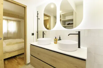 two sinks on a counter in a bathroom at Chalet Béchar Le Magnifique- Garden - Sauna & Jacuzzi in Les Houches