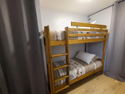 a couple of bunk beds in a room at Studio cosy de 23 m2 à la montagne in Samoëns