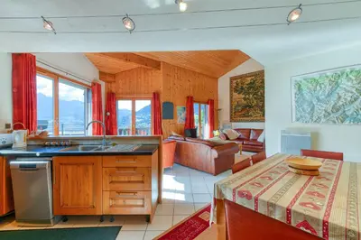 a kitchen and living room with a couch at Les Terrasses de Bel Alp in Saint-Gervais-les-Bains