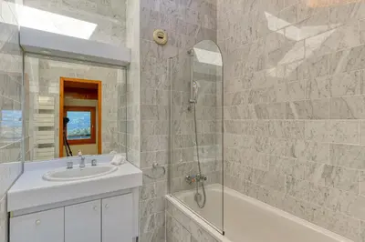 a bathroom with a sink and a shower and a tub at Les Terrasses de Bel Alp in Saint-Gervais-les-Bains