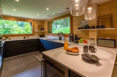 a kitchen with a table with a bowl of food on it at Chalet Bonnabelle - Chamonix All Year in Chamonix-Mont-Blanc