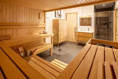 a room with a sauna with a sink and a stove at Chalet Bonnabelle - Chamonix All Year in Chamonix-Mont-Blanc