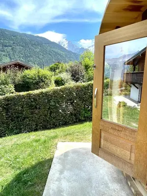 a door to a house with a view of the mountains at Chalet familial Saint-Gervais in Saint-Gervais-les-Bains