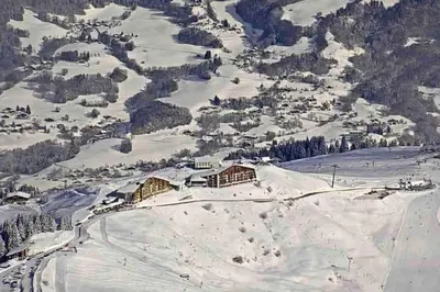 a group of people skiing in the snow at Samoens 1600, Grand Massif in Samoëns