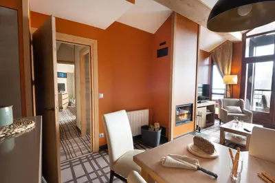 a ski lodge on a mountain with snow covered trees at Résidence Pierre & Vacances Premium Les Terrasses d'Hélios in Flaine