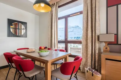 an apartment building with snow on the roof at Résidence Pierre & Vacances Premium Les Terrasses d'Hélios in Flaine