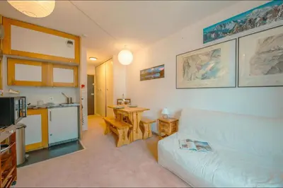 a living room with a couch and a table at Chamonix Sud - Bâtiment Iris 374 - Happy Rentals in Chamonix-Mont-Blanc
